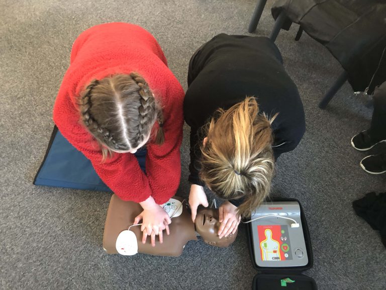 school pupils training in CPR.